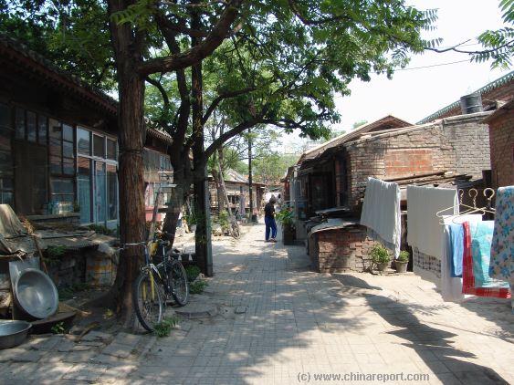 An ancient Hutong Alley with small Greenhouses ...